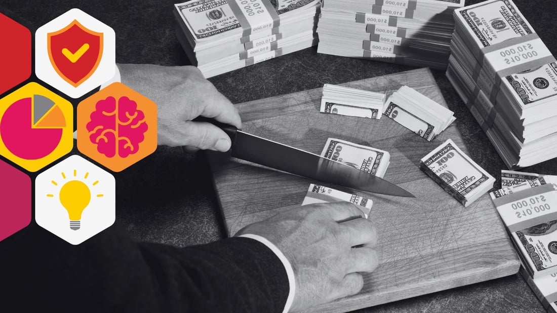 a man in a suit cuts stacks of money with a knife on a cutting board
