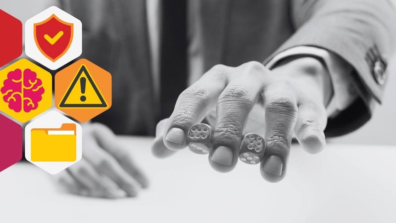 Blog header showing a man in a suit holding two dice between his fingers.