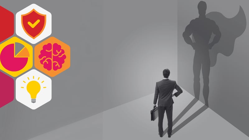 a business man casts the shadow of a superhero 