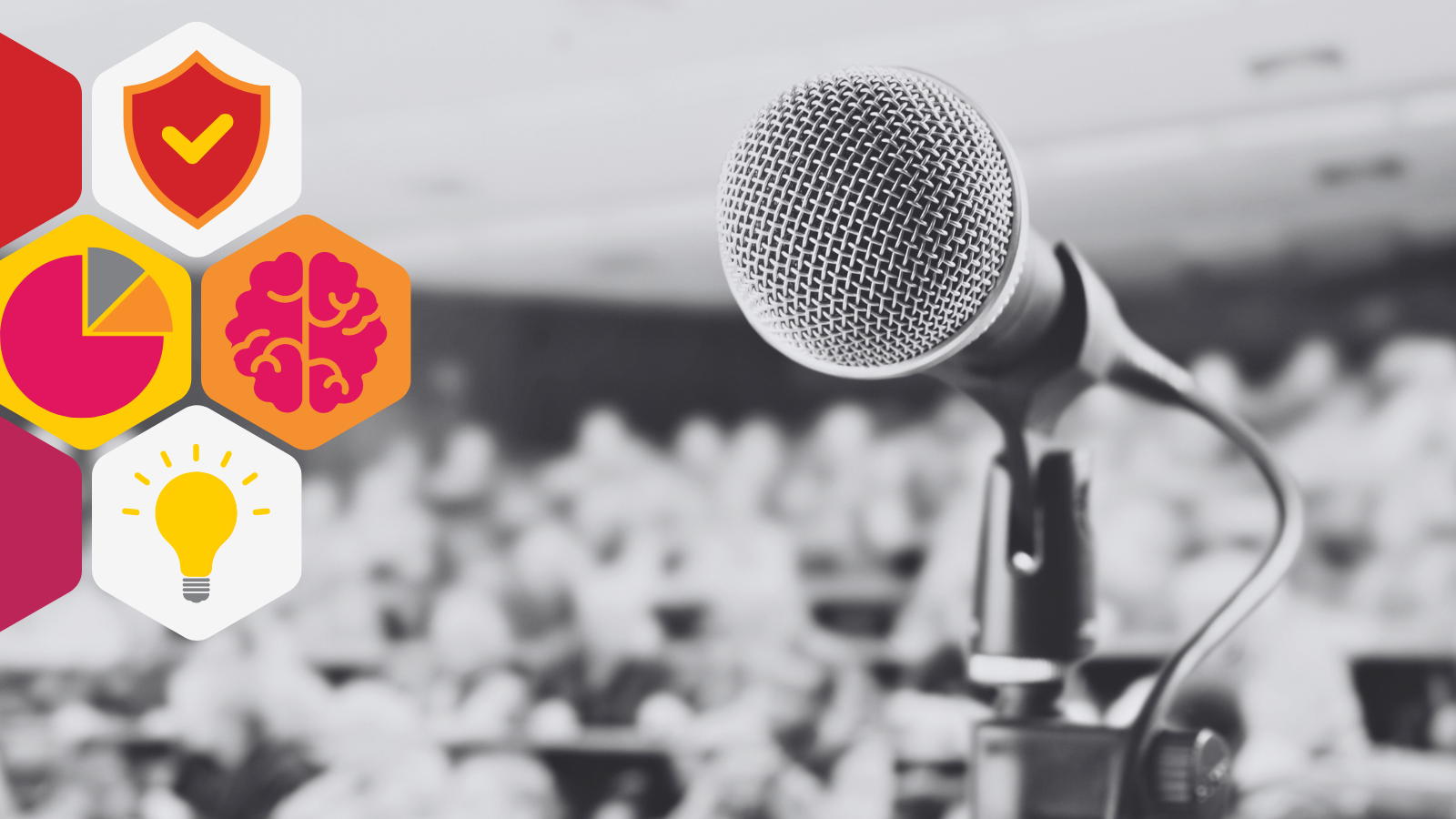 a microphone in front of a crowded and attentive audience