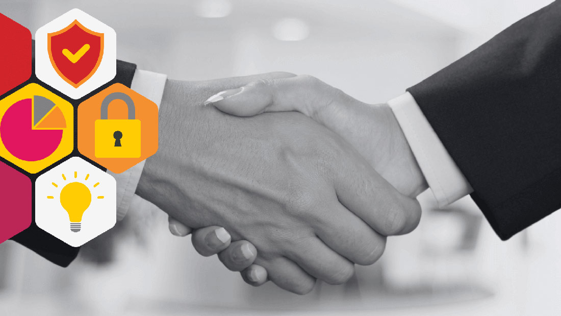 A man and woman's hands shaking, engaging in a business deal